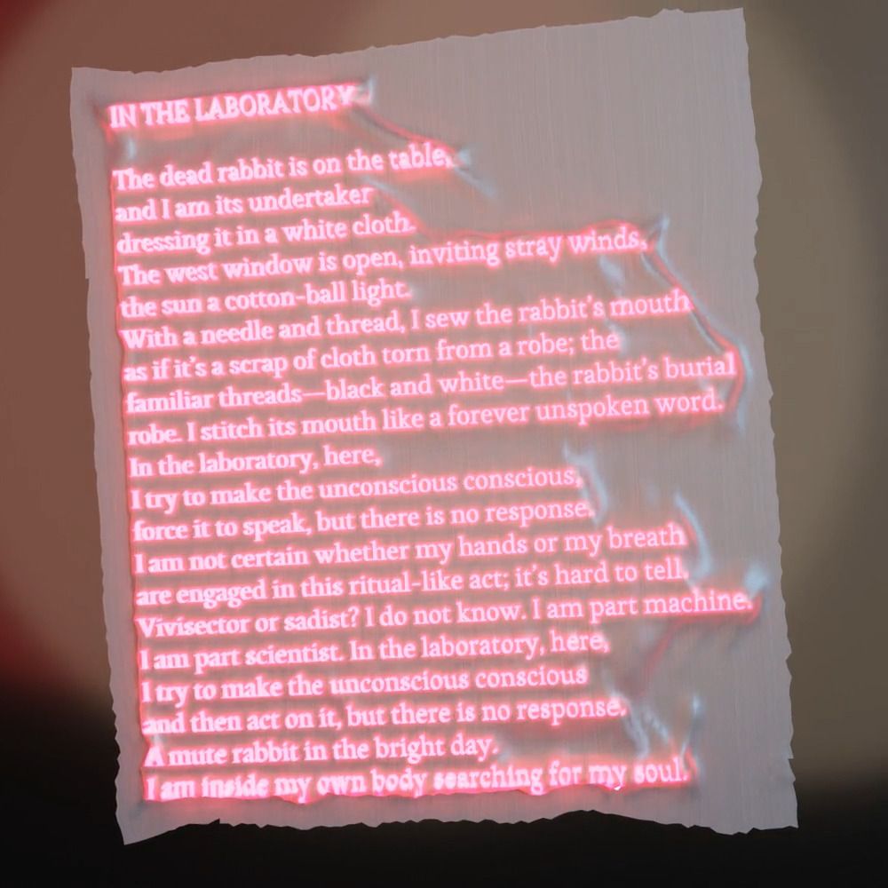 A still image of "In the Laboratory," with the poem modeled onto a moving object, with flashing text